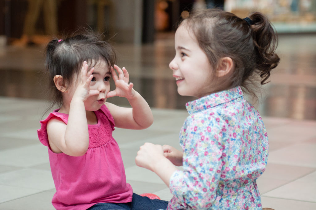 Sisters making funny faces during Tina Captures Photography Family Session