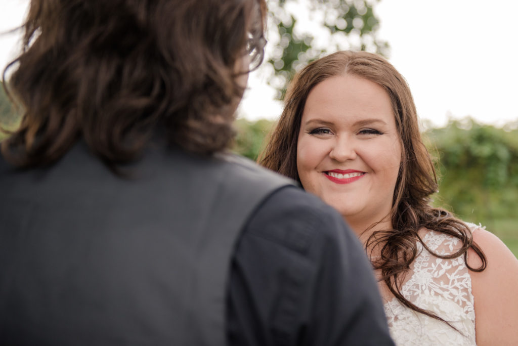 Jesse & Paige McEachran Homestead Winery outdoor wedding bride and groom by Tina Captures Photography