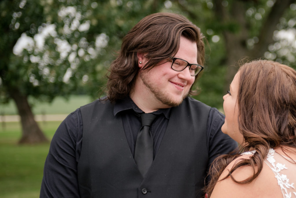 Jesse & Paige McEachran Homestead Winery outdoor wedding bride and groom by Tina Captures Photography