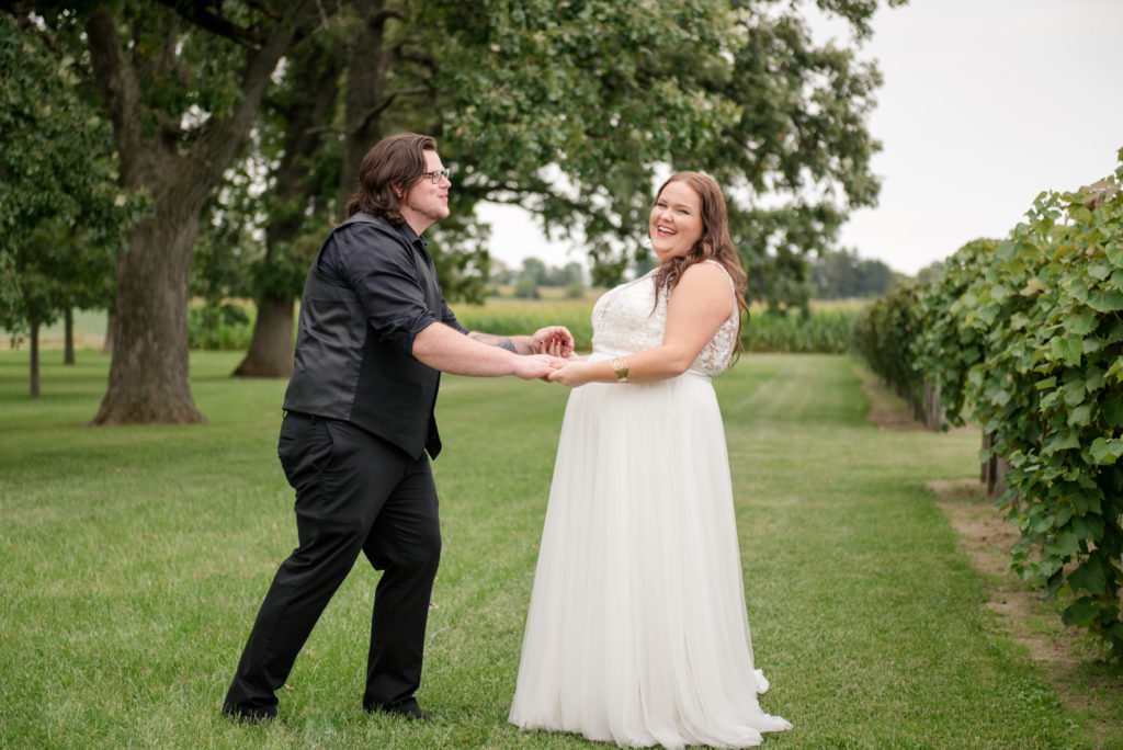 Jesse & Paige McEachran Homestead Winery outdoor winery wedding bride and groom by Tina Captures Photography