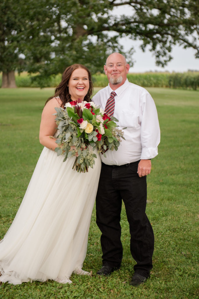 Jesse & Paige McEachran Homestead Winery outdoor wedding bride and groom's father by Tina Captures Photography