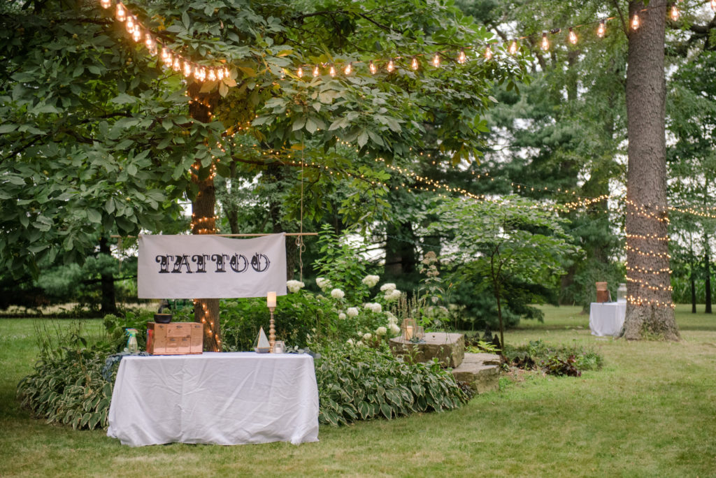 Jesse & Paige McEachran Homestead Winery outdoor wedding reception details temporary tattoo station by Tina Captures Photography