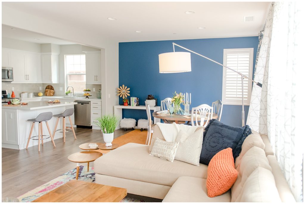 Open concept view of kitchen, dining room, and living room. Designed by McFadden & Grace. Tina Captures Photography.