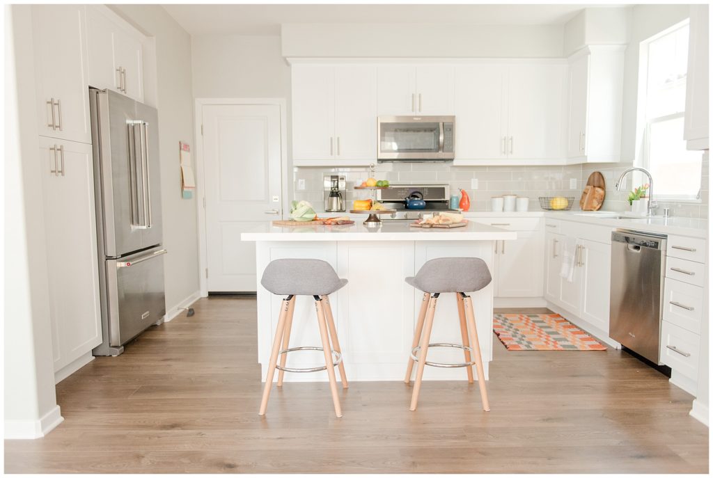 Kitchen with white cabinets. Designed by McFadden & Grace. Tina Captures Photography.