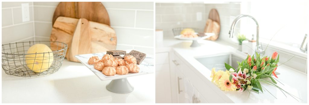 Kitchen counter sink with fresh flowers, baked goods and cutting boards. Designed by McFadden & Grace. Tina Captures Photography.