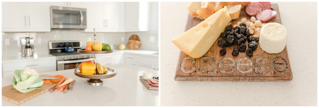 Fruits and veggies on the kitchen island and cheese cutting board with snacks. Designed by McFadden & Grace. Tina Captures Photography.