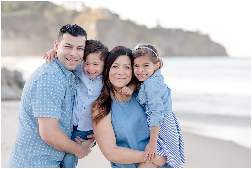 Family of four portrait during orange county beach family session