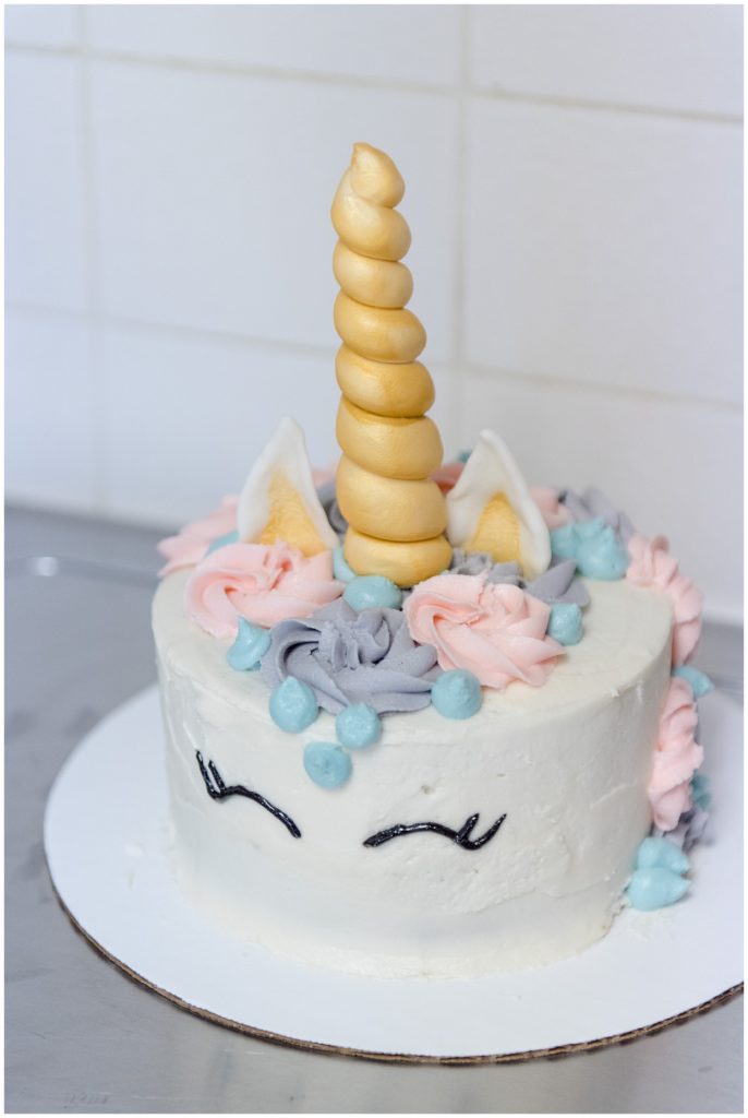 Unicorn birthday cake with pastel colors