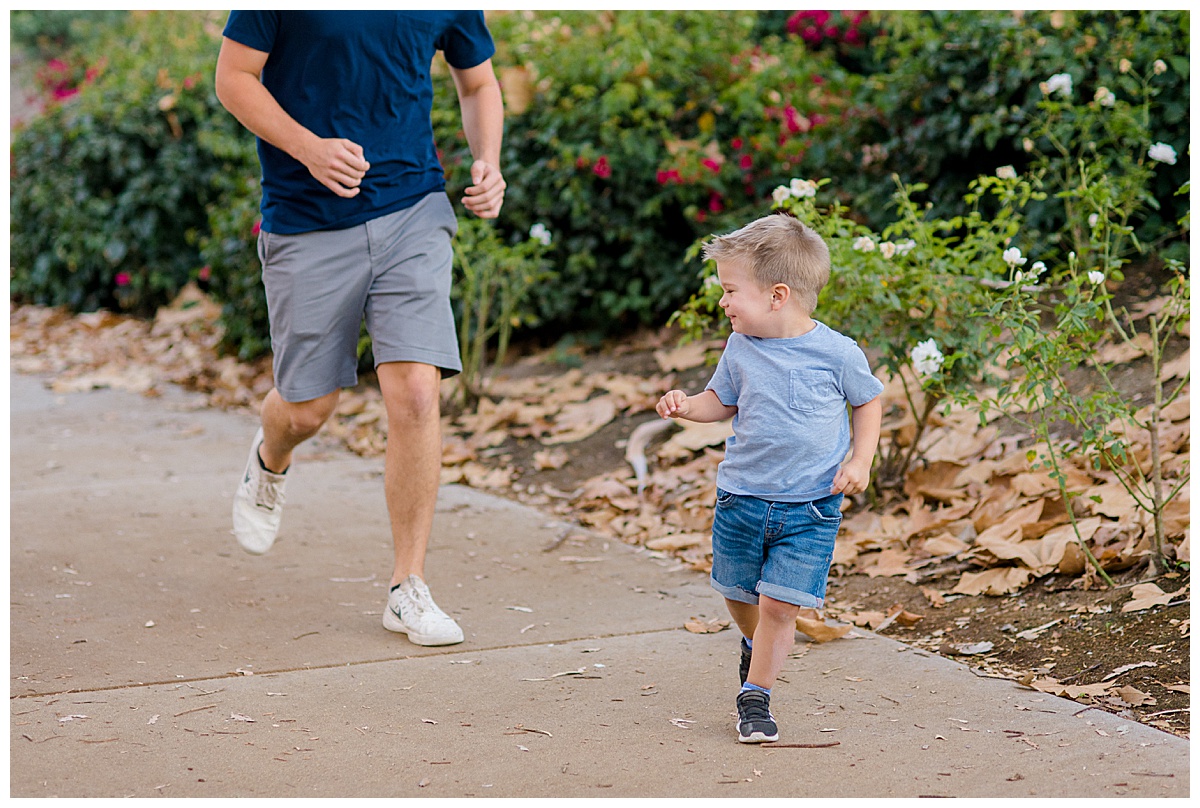 older brother running after baby brother